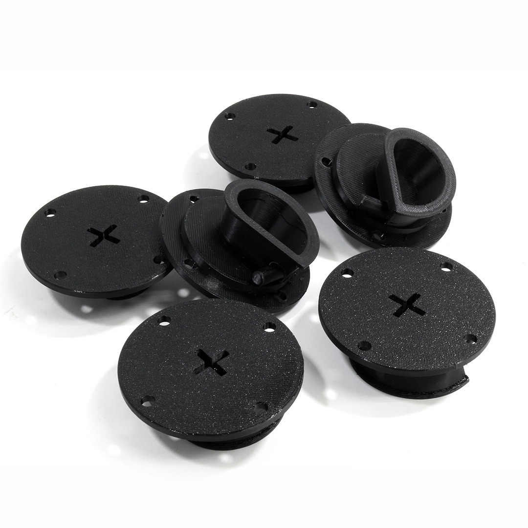 Bed liner plugs installed in Nissan D21 truck bed